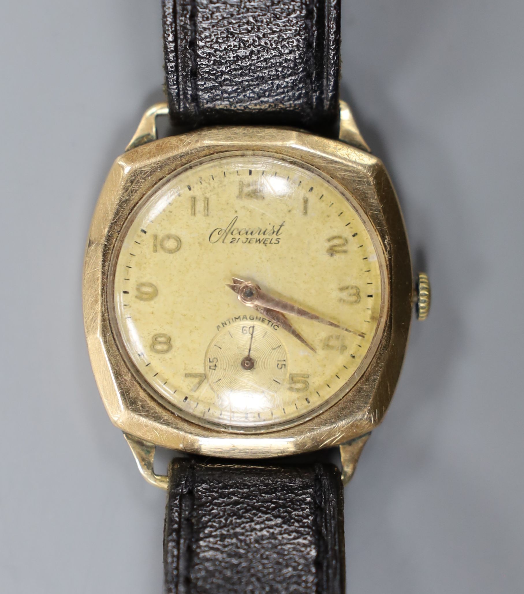 A gentleman's 1950's 9ct gold Accurist manual wind wrist watch, on associated leather strap, gross weight 29.7 grams.